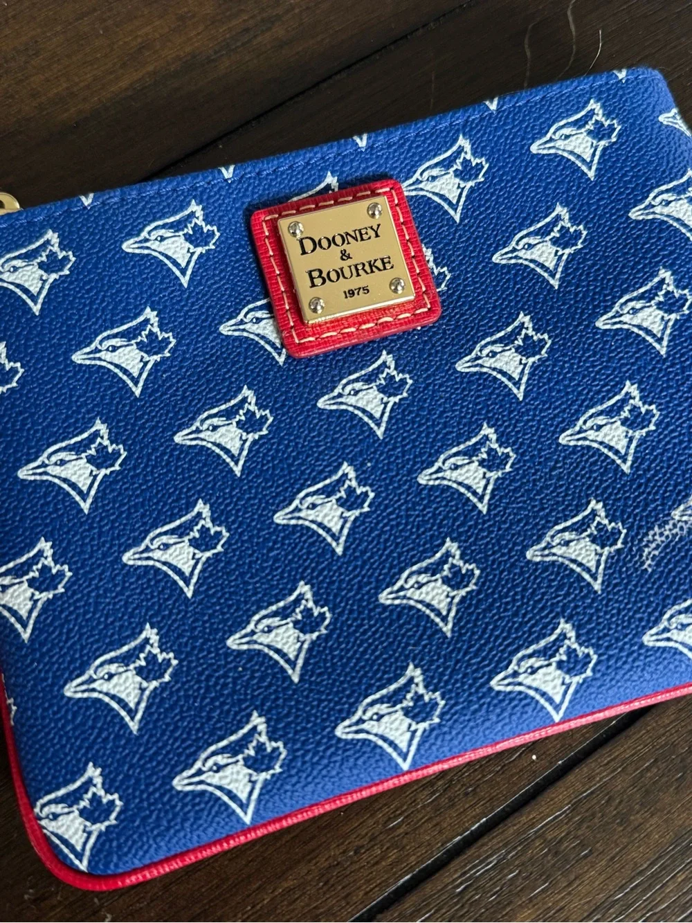 Dooney & Bourke Blue Wristlet with Red Trim and Tassel